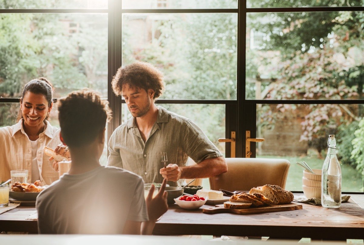 A family at home in the kitchen, with no salesperson in the room